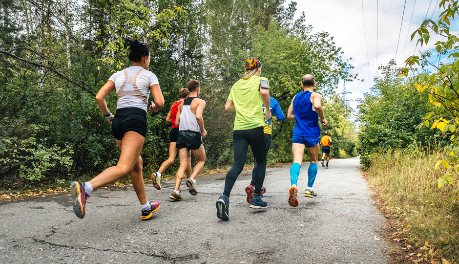 Chelyabinsk, Russia - September 11, 2016: group of athletes runners running marathon in fall city Park during City marathon